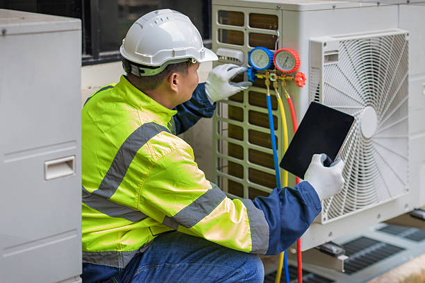 Professional Heat Pump Repair technician working in Amery, WI